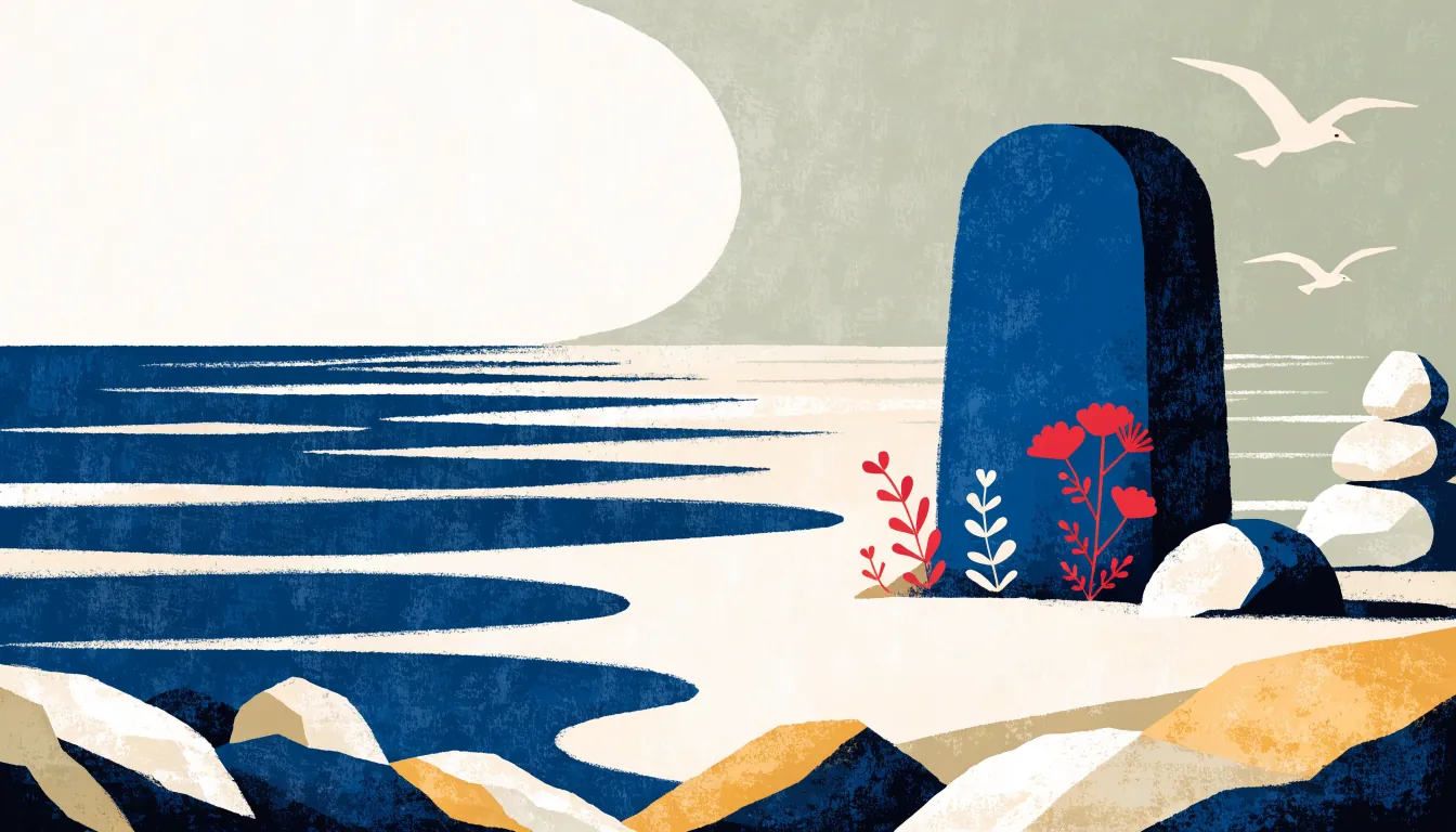 Minnestein ved havet med blomster